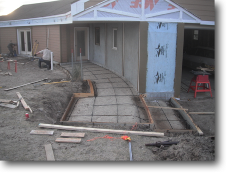 Forming and re-bar for the third 2012 concrete project, a sidewalk along the garage to the library.