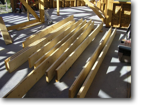The floor joists arranged as they will be installed on the second floor.