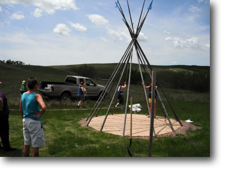 A group of women from Sioux Falls set uptake tipis one afternoon.