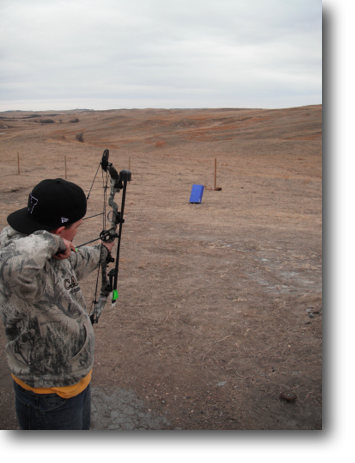 Dean practicing with his compound bow.