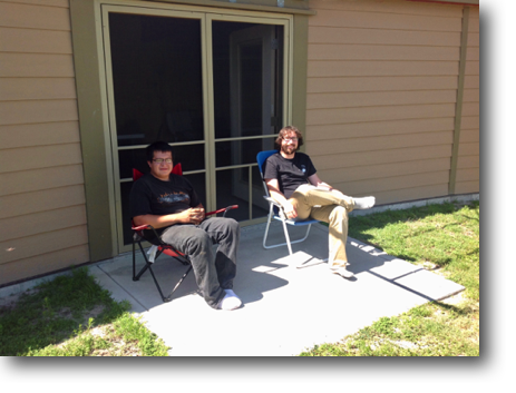 Tyler and Corey  kicking back on the library's patio.
