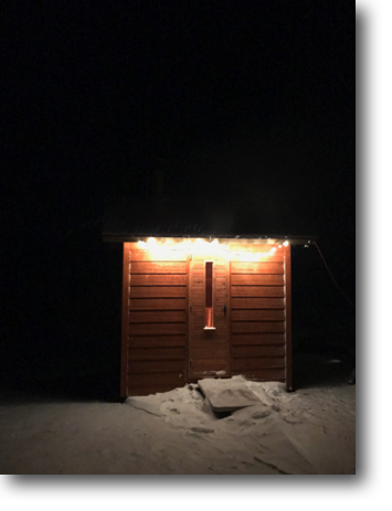 String lights help illuminate the sauna at night.
