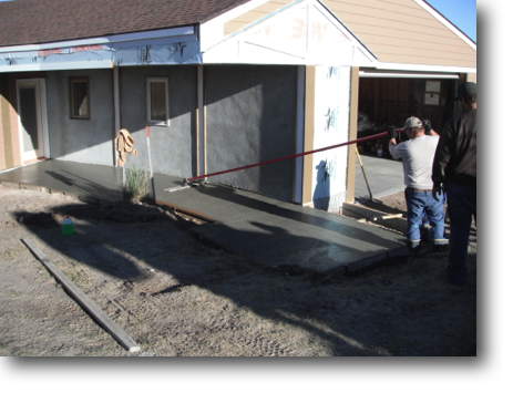 Kenny working his magic "floating" the wet concrete.