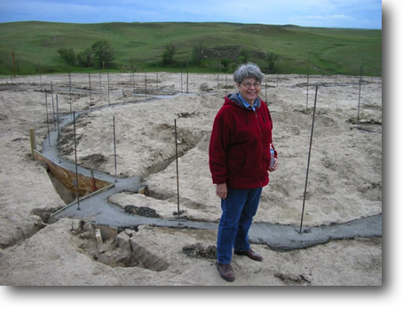 Mom with the foundation walls poured.