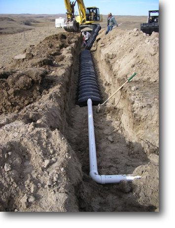 Installing the drain field beyond an elbow from the septic tank.