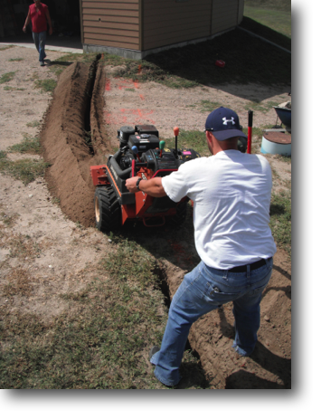 Justin and Clay trenching the electrical power to the garage.